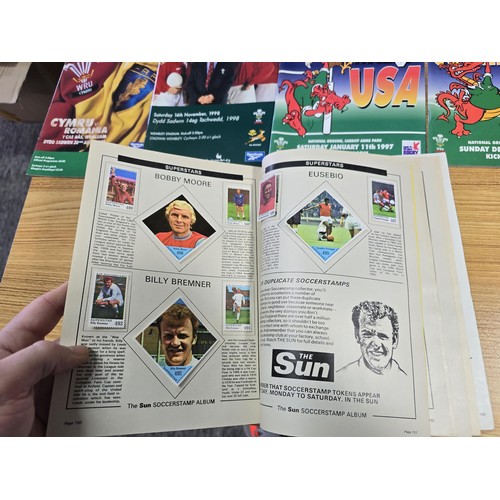 72 - A large collection of Rugby programmes along with a complete The Sun encyclopedia and soccer stamp a... 