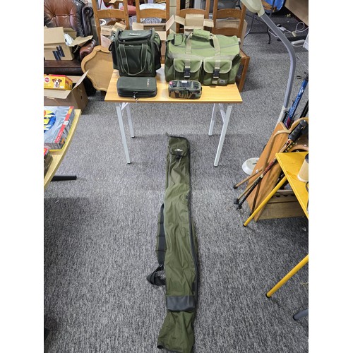 73 - A quantity of fishing related bags to include carp fishing bag by Crane, a fishing rod Holdall by Cr... 