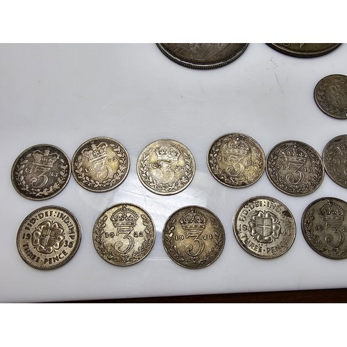 174 - A collection of various coins to include a large quantity of silver cons to include a good amount of... 