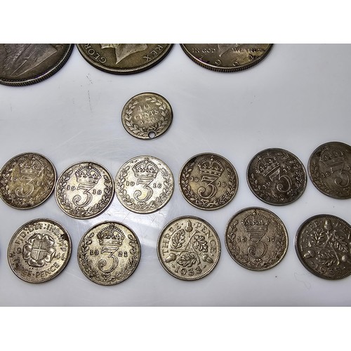 174 - A collection of various coins to include a large quantity of silver cons to include a good amount of... 