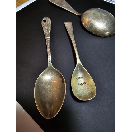 180 - A collection of 4x hallmarked silver spoons and white metal pickle fork. To include 3 silver spoons ... 