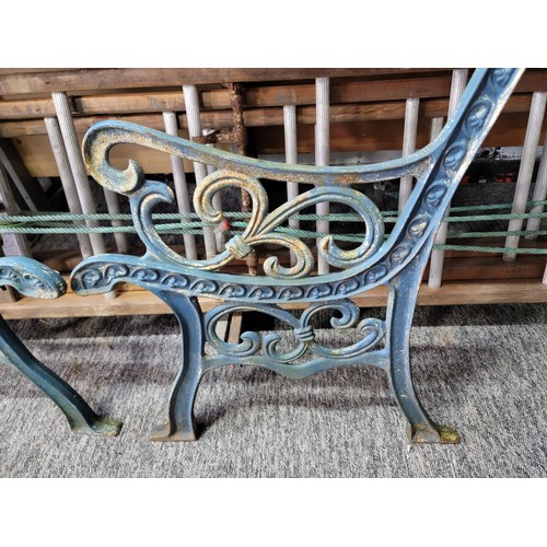 373 - Pair of cast iron ornate bench ends painted in blue, measure 81cm high 52cm wide