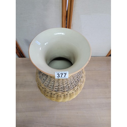 378 - Large ceramic vase with wicker casing, vase has an old repair to the lip stands at 53cm high diamete... 