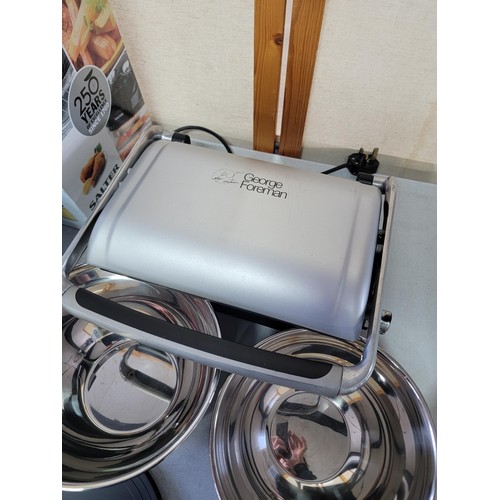 Boxed Salter low fat fryer in box working, a Foreman grill