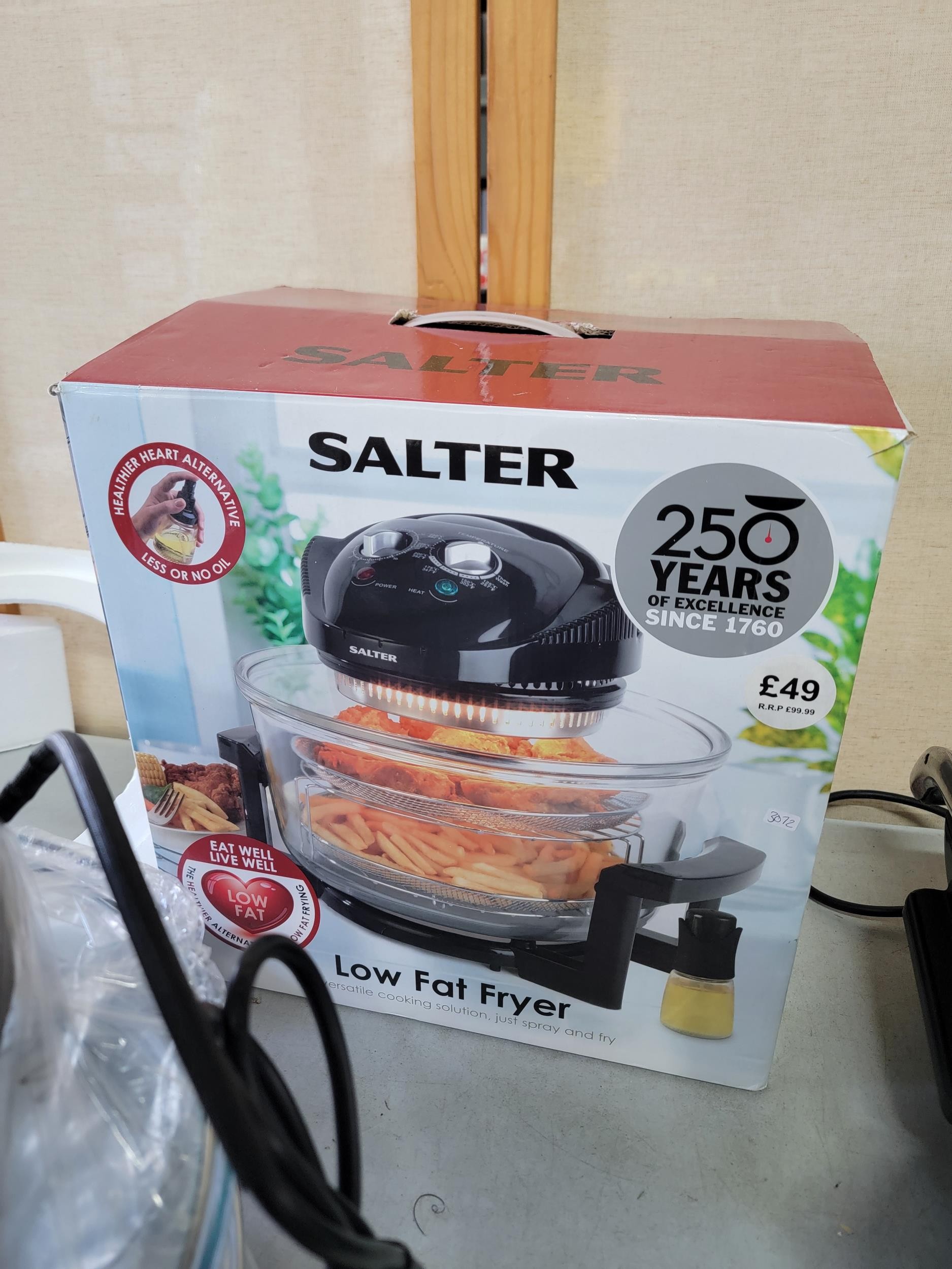 Boxed Salter low fat fryer in box working, a Foreman grill