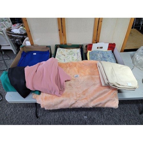 444 - Three boxes of assorted fabrics, including peach fleece (3m), black fabric (3.4m), red fabric (2.25m... 