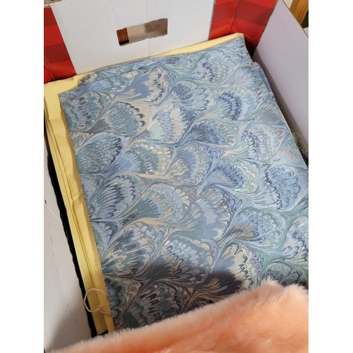 444 - Three boxes of assorted fabrics, including peach fleece (3m), black fabric (3.4m), red fabric (2.25m... 