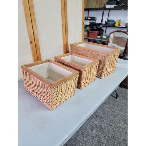 445 - 3x wicker framed lined laundry baskets largest measures 31cm high, 54cm long, 33cm wide