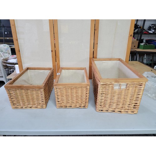 445 - 3x wicker framed lined laundry baskets largest measures 31cm high, 54cm long, 33cm wide