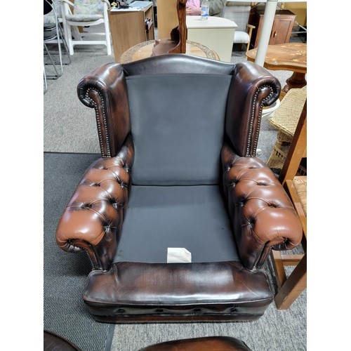 458 - Good quality brown leather wing back Chesterfield style button back and button arm chair, studded to... 