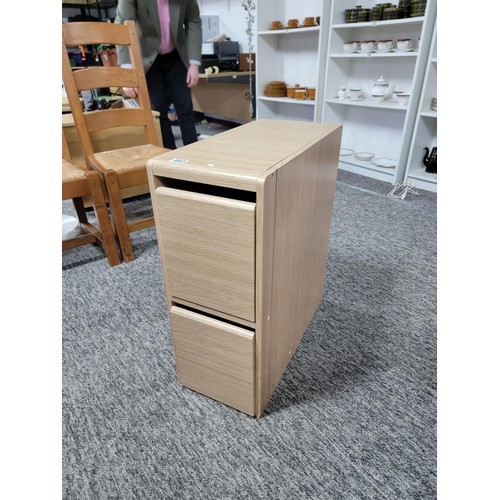 460 - A good quality narrow wooden 2 drawer filing cabinet measures 69cm high, 28cm wide 60cm deep