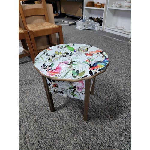 462 - Circular top sewing table with yellow lining drawer to the base has been decorated with bird design ... 