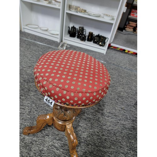 464 - Antique Victorian J. Fitter oak piano stool with studded red seat, very well carved to the base, sto... 