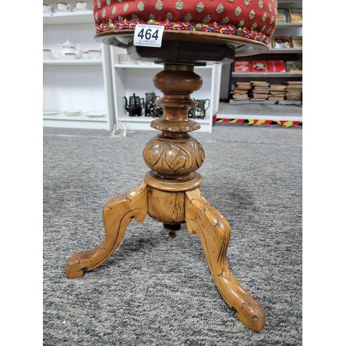 464 - Antique Victorian J. Fitter oak piano stool with studded red seat, very well carved to the base, sto... 