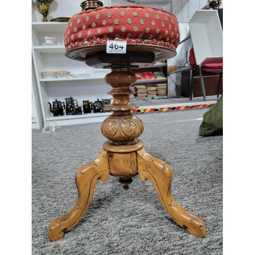 464 - Antique Victorian J. Fitter oak piano stool with studded red seat, very well carved to the base, sto... 