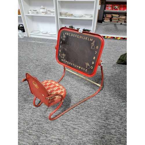 465 - A vintage 1950's metal child's Mobo chair with drawing board attached, seat is well decorated length... 