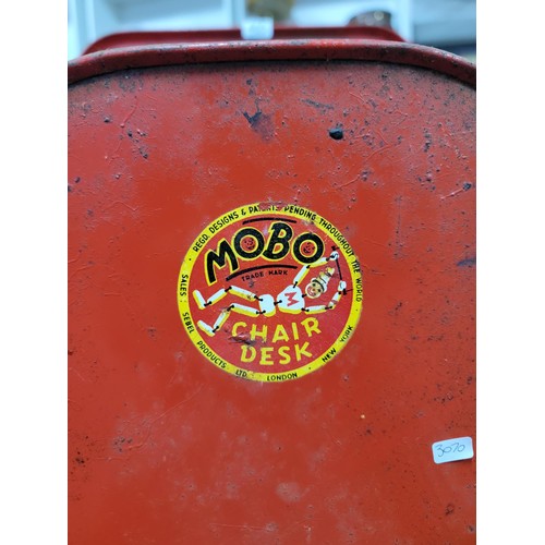 465 - A vintage 1950's metal child's Mobo chair with drawing board attached, seat is well decorated length... 