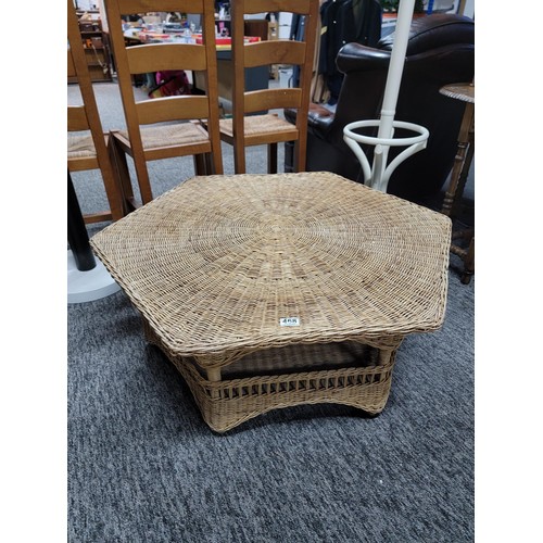 468 - Large hexagonal wicker table with galleried shelf to the base in overall good condition stands at 40... 