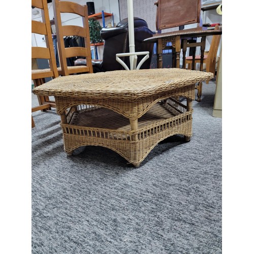 468 - Large hexagonal wicker table with galleried shelf to the base in overall good condition stands at 40... 