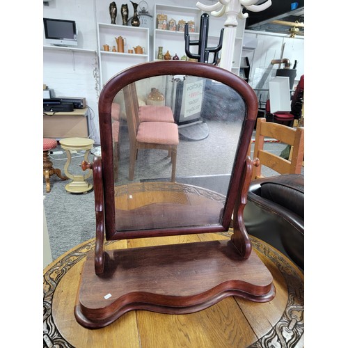 472 - An antique mahogany dressing table mirror with sepentine front ware to the top of the mirror stands ... 