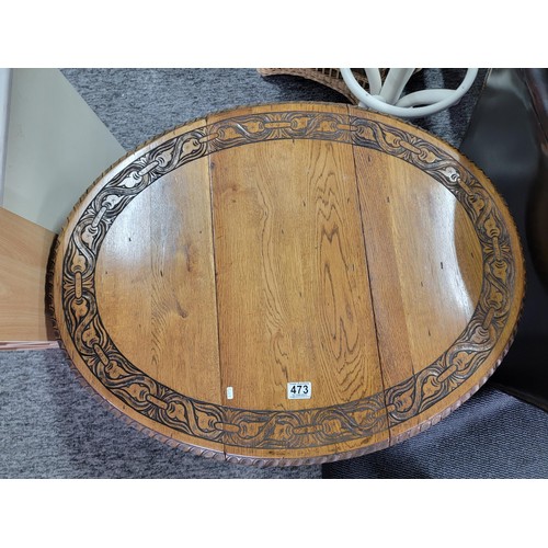 473 - A good antique 1920's  well carved oak circualr drop leaf table with carving ro the edges, gate legs... 