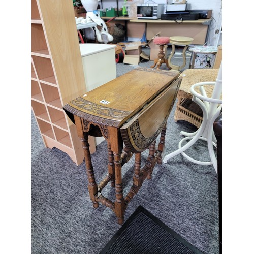 473 - A good antique 1920's  well carved oak circualr drop leaf table with carving ro the edges, gate legs... 