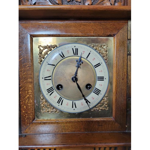 152 - Good quality Jungans striking walnut bracket clock well carved with intricate carving to the top dep... 