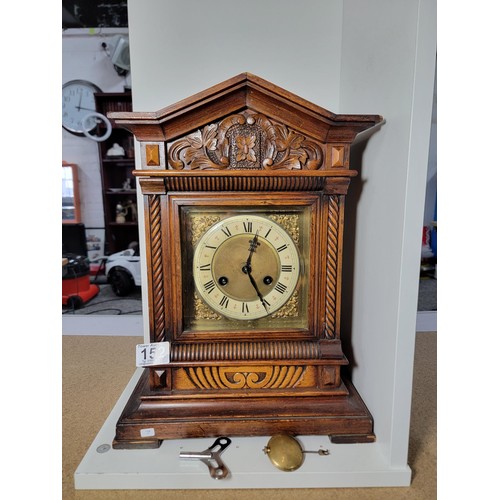 152 - Good quality Jungans striking walnut bracket clock well carved with intricate carving to the top dep... 