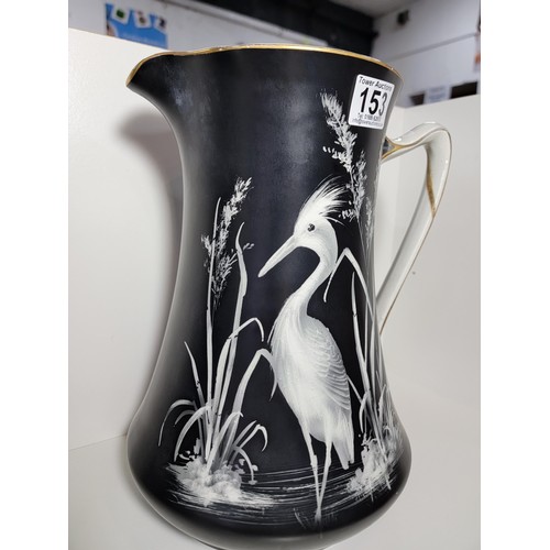 153 - Pair of large Lawleys black and white egret decorated jugs, both jugs have gilding to the handles, o... 