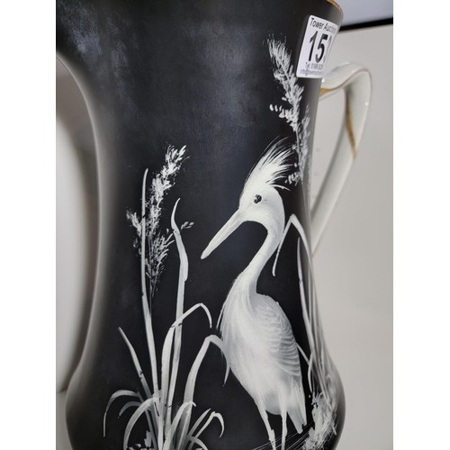 153 - Pair of large Lawleys black and white egret decorated jugs, both jugs have gilding to the handles, o... 