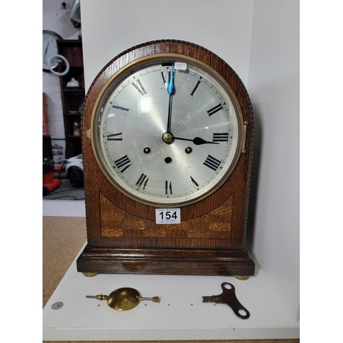 154 - Gustav Becker Domed Mantel Clock, with bevelled glass front silvered dial, chiming on gong rods, nee... 