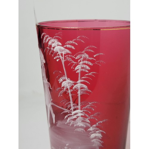 158 - Good quality antique Mary Gregory cranberry tumbler with white enamelling design of a girl chasing b... 