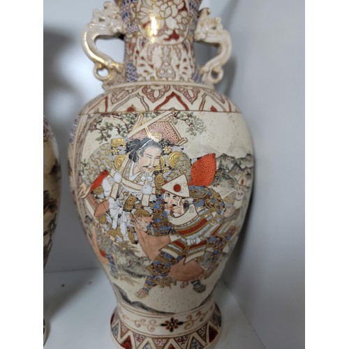 163 - Pair of antique Satsuma hand painted vases, with lion handles, scenes depicting oriental figures, tw... 