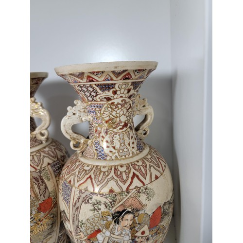 163 - Pair of antique Satsuma hand painted vases, with lion handles, scenes depicting oriental figures, tw... 