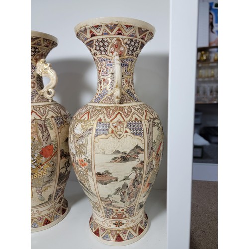 163 - Pair of antique Satsuma hand painted vases, with lion handles, scenes depicting oriental figures, tw... 