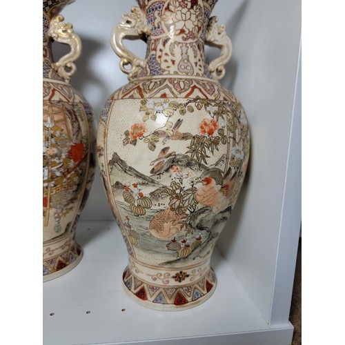 163 - Pair of antique Satsuma hand painted vases, with lion handles, scenes depicting oriental figures, tw... 