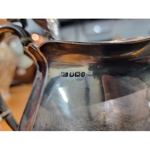 166 - Hallmarked silver teapot by Harry Atkin, Sheffield 1921, with inscription to the front for acts of h... 