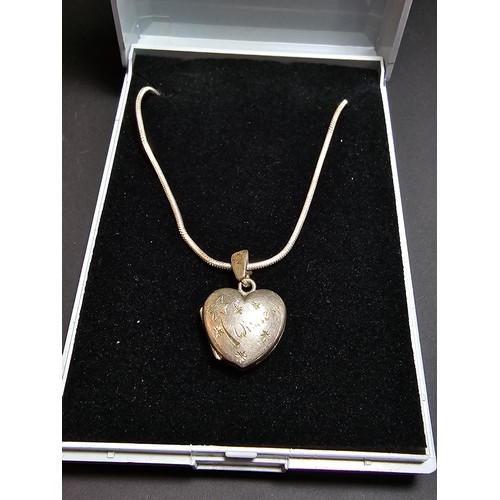 206 - A 925 silver heart locket marked 