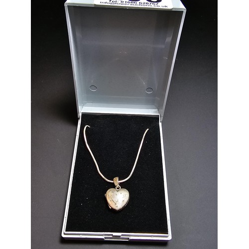 206 - A 925 silver heart locket marked 