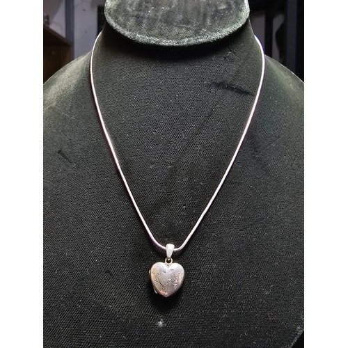 206 - A 925 silver heart locket marked 