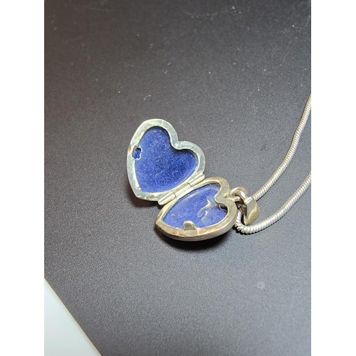 206 - A 925 silver heart locket marked 