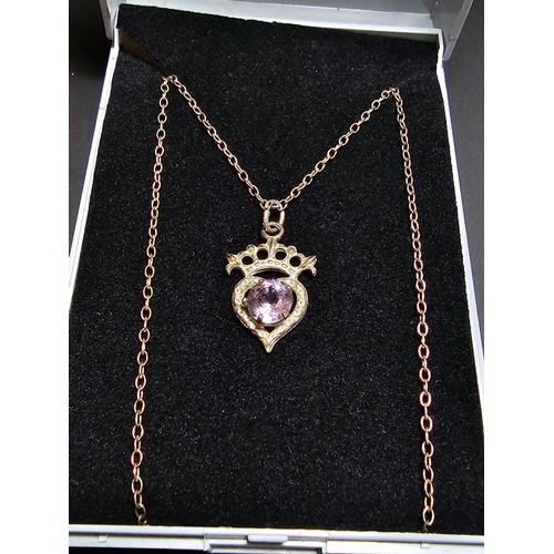 207 - A pretty vintage 925 silver pendant inset with an amethyst, set on an 18