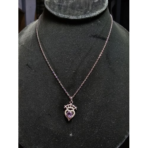 207 - A pretty vintage 925 silver pendant inset with an amethyst, set on an 18