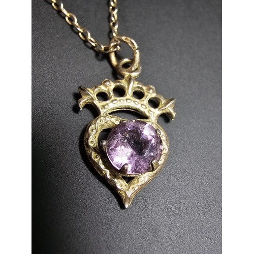 207 - A pretty vintage 925 silver pendant inset with an amethyst, set on an 18