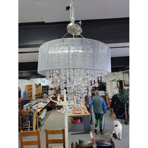 467 - Large circular 4 tier plastic teadrop lamp shade with grey cotton edge in overall good condition dia... 