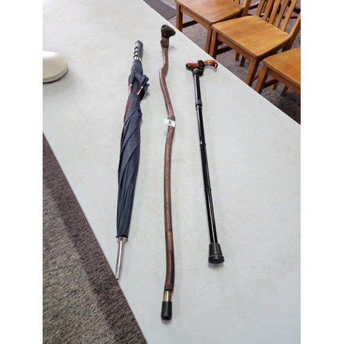 5 - Shillelagh style walking stick, 1x other adjustable walking stick and a Donnay International umbrell... 