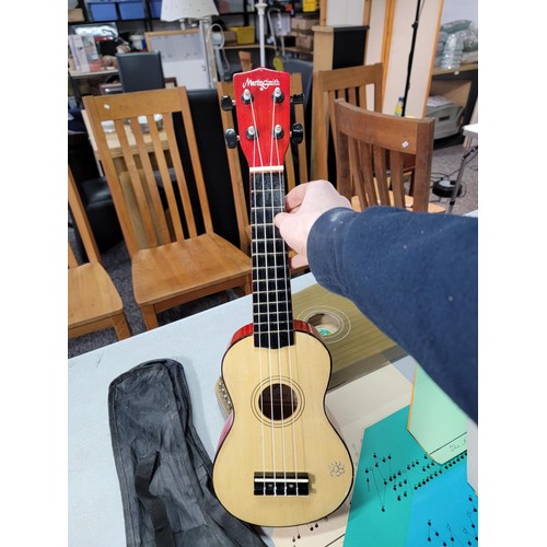 12 - Modern Martin Smith ukulele cased in excellent condition along with a Zither by Lark along with a qu... 