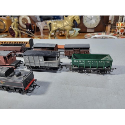 15 - Box of 00 gauge rolling stock along with a dummy locomotive with various brands inc Hornby, Tri-ang ... 