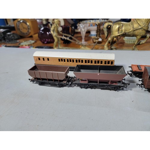 15 - Box of 00 gauge rolling stock along with a dummy locomotive with various brands inc Hornby, Tri-ang ... 