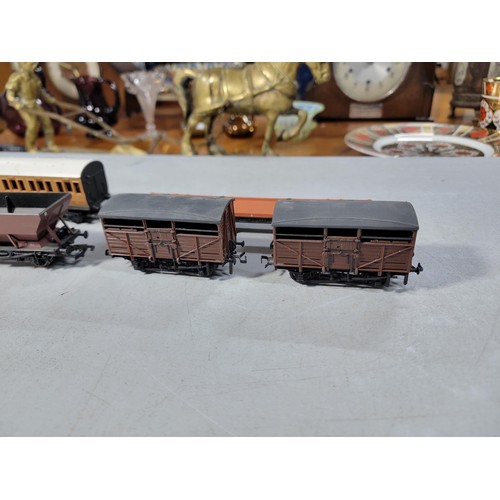 15 - Box of 00 gauge rolling stock along with a dummy locomotive with various brands inc Hornby, Tri-ang ... 